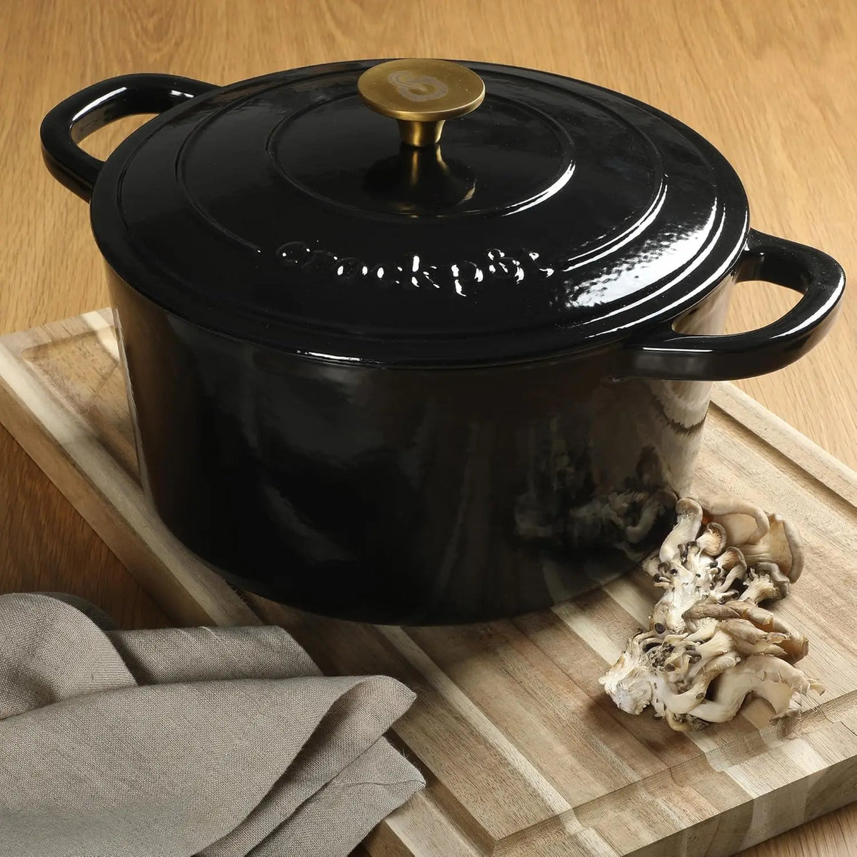 Crock Pot Artisan 7-Quart Round Cast Iron Dutch Oven with Lid – Black Enamel Finish, Gold Knob